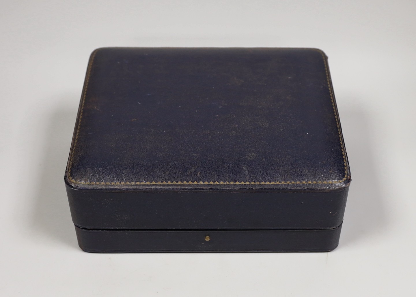 A Mappin & Webb leather display box, width 24cm.